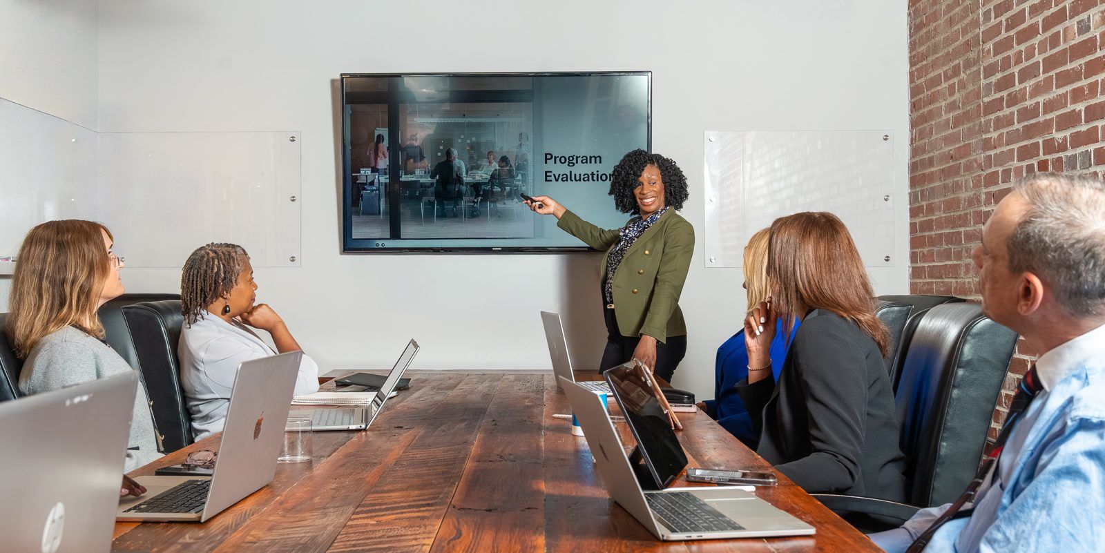 Cassandra presenting a program evaluation to a client team
